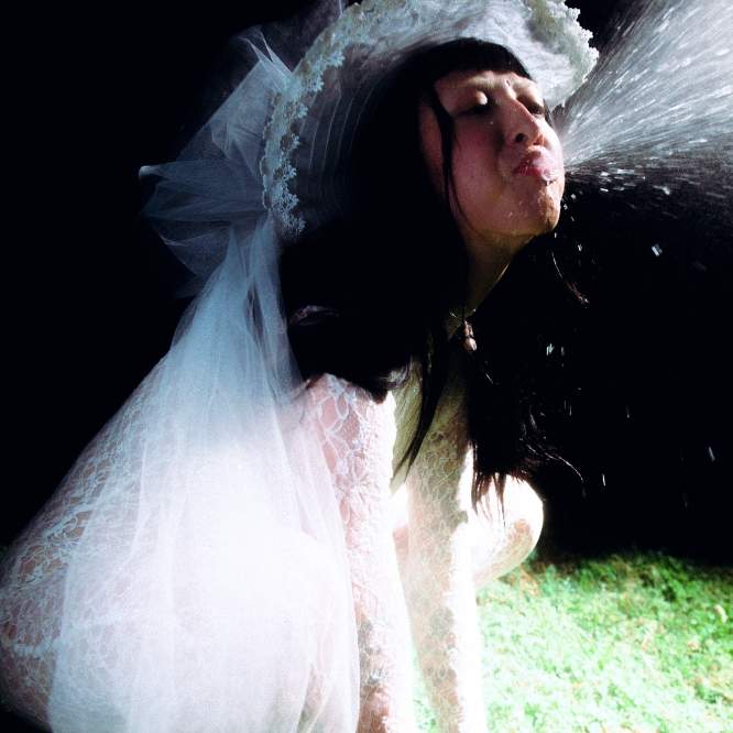 Indie-rock breakout Meg Elsier returns with the 17-track spittake (deluxe)—a rawer, more unfiltered, expanded version of her debut album, spittake.