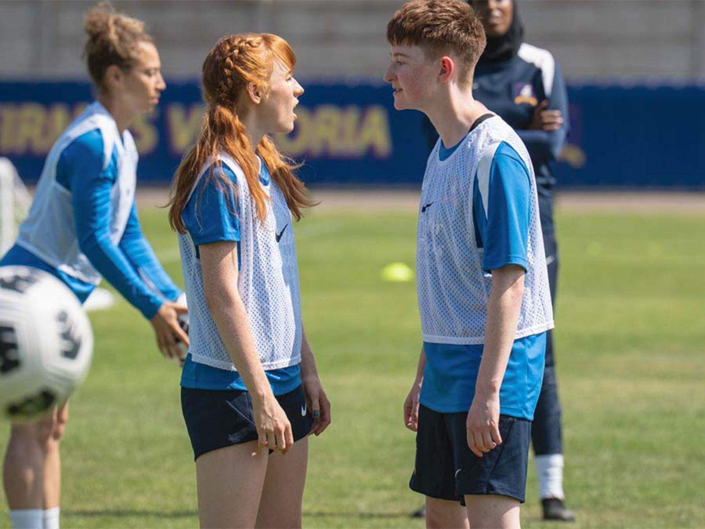 Two women football players, who are twin sisters, are seen fighting verbally during a training session in this episode of Ted Lasso.
