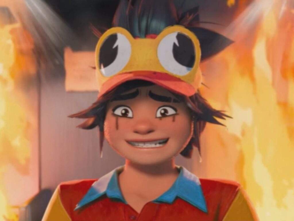 Jo forces a nervous cry as flames rage behind her, wearing a yellow cap with cartoon eyes and a colorful fast food uniform while sweat and soot mark her frightened face.