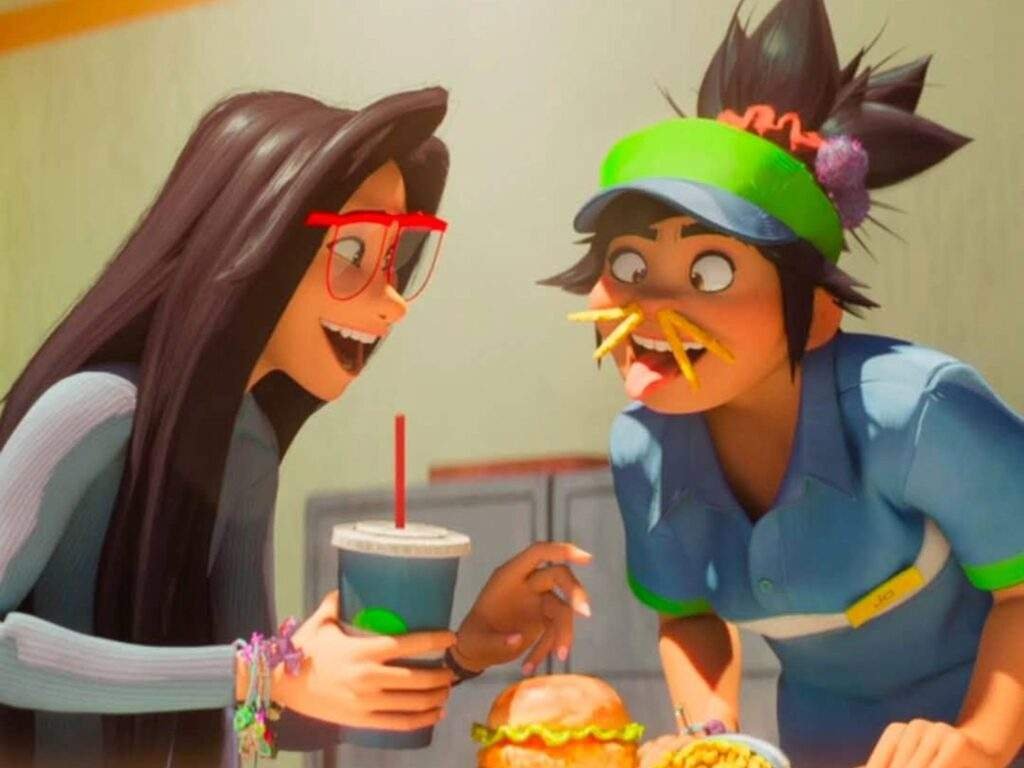 Raissa laughs as Jo playfully balances French fries under her nose like a mustache while they share a meal, capturing the pair's fun and lighthearted friendship.