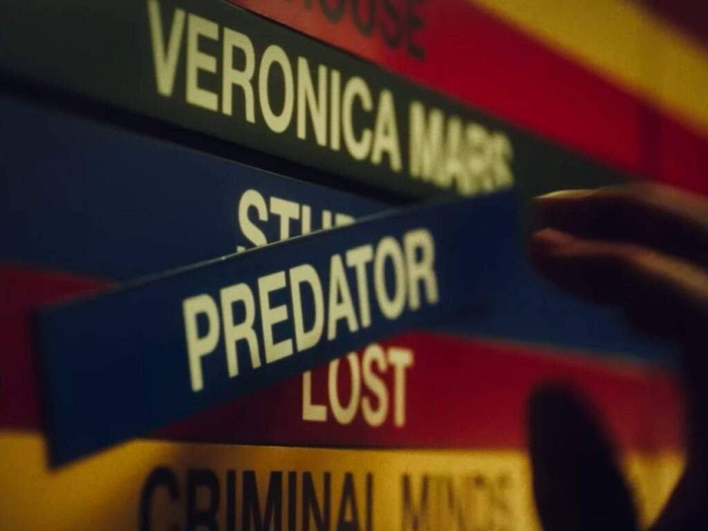 Primetime Jeff Zucker's hand rearranges television program title cards, including Veronica Mars, (To Catch a) Predator, Lost, and Criminal Minds, while analyzing primetime programming slots in Primetime (2026).
